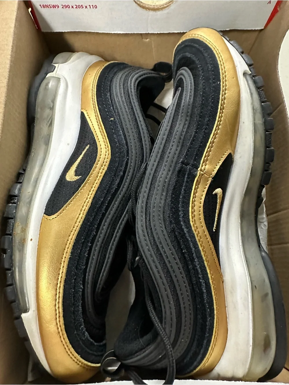 Nike Kids Black Sneakers with Gold Accents